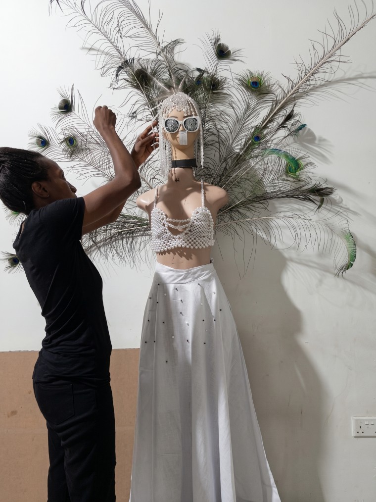 Irene Mugwagwa bringing one of her designs to life