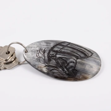 Zebra on dark scrimshawed bone keychain handcraft from Zimbabwe
