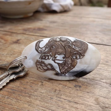 Buffalo scrimshawed bone keychain handcraft from Zimbabwe