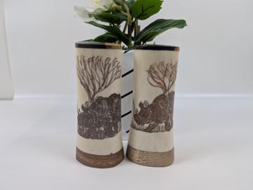 Rustic set of two saltshaker crafted from bone and wood with Rhino scrimshawed on them
