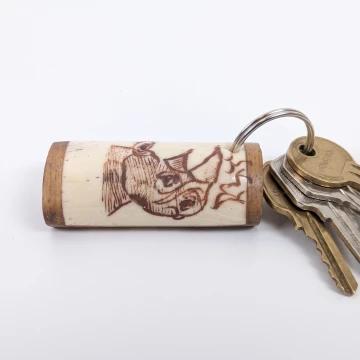 Rhino scrimshawed keychain made from wood and cow bone