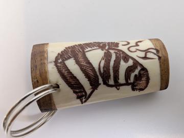 Zebra scrimshawed keychain made from wood and cow bone