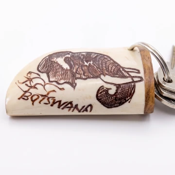 Elephant scrimshawed keychain made from wood and cow bone with curved edges